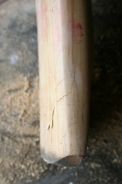 Edge damage. Face damage. Internal damage. A cricket bat ready for repair.