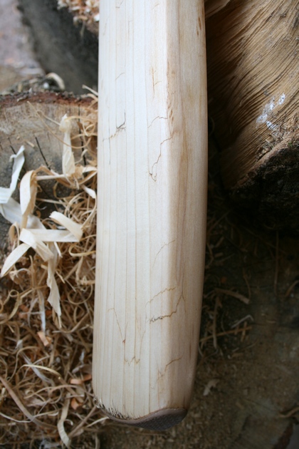 Bottom edge of cricket bat repaired.